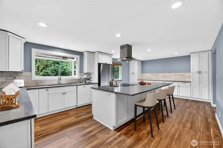 REMODELED KITCHEN in 2019  9’8” long quartz buffet/side bar with 2 built in side pantries with lower cabinets & drawers  Large undermount sink with spray wand / Garden window  5 burner flat top stove with convection oven / Whirlpool dishwasher  Samsung side-by-side refrigerator with freezer drawer – NEW in 2023  Soft close doors / Deep drawers / Pan cabinet  Garbage/Recycle drawer / Recessed lights  Wood wrapped bay window overlooks rear yard
