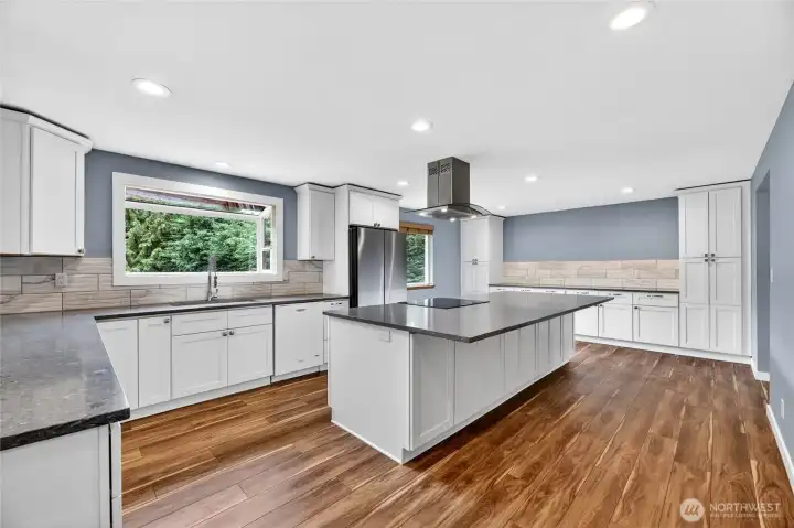 REMODELED KITCHEN in 2019  9’8” long quartz buffet/side bar with 2 built in side pantries with lower cabinets & drawers  Large undermount sink with spray wand / Garden window  5 burner flat top stove with convection oven / Whirlpool dishwasher  Samsung side-by-side refrigerator with freezer drawer – NEW in 2023  Soft close doors / Deep drawers / Pan cabinet  Garbage/Recycle drawer / Recessed lights  Wood wrapped bay window overlooks rear yard