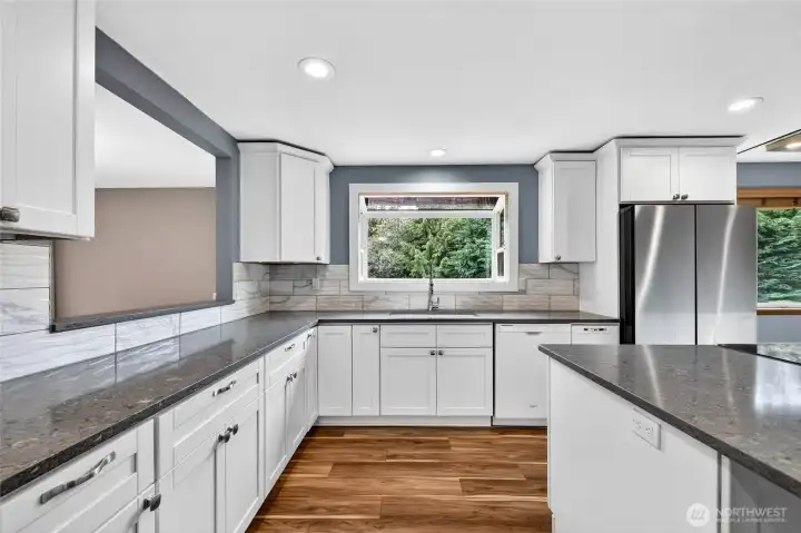 LOTS of workspace on quartz countertops / Tile wall backsplash accents
