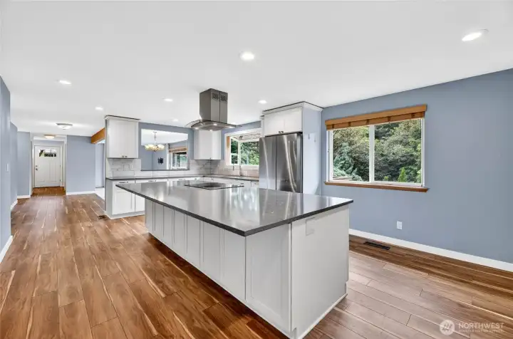 HUGE 10 ½‘ x 4 ½‘  center quartz island with electrical outlet & room for 5 bar stools
