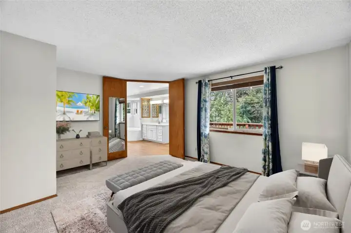 LARGE PRIMARY SUITE  Picture window overlooks rear yard / Ceiling fan