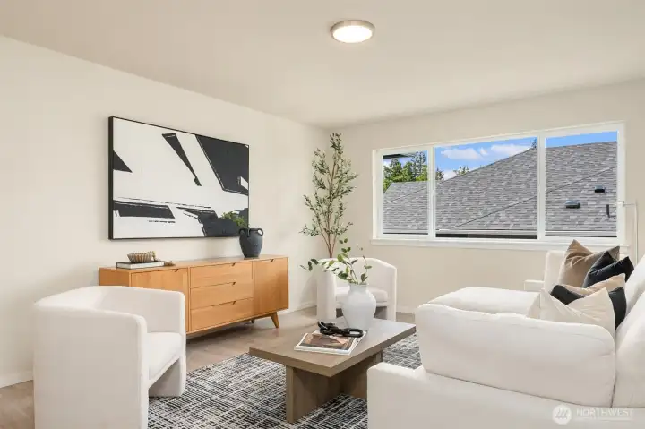 Upper level bonus loft offers a flexible secondary living space ideal for a media lounge, playroom, home office, or quiet retreat, thoughtfully positioned to provide separation from the main living areas.
