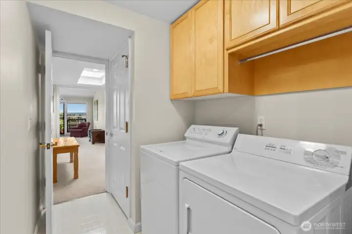 A convenient utility room keeps essentials organized and out of sight.