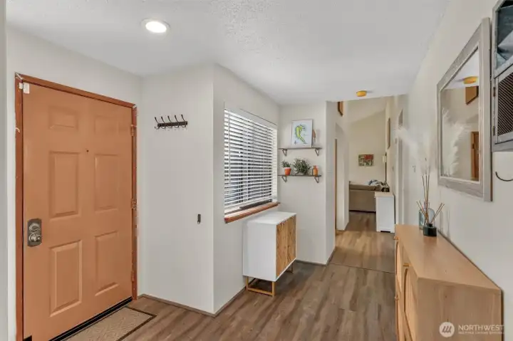 Large open entry with catch all space and new luxury vinyl flooring. Large open entry with catch all space and new luxury vinyl flooring.