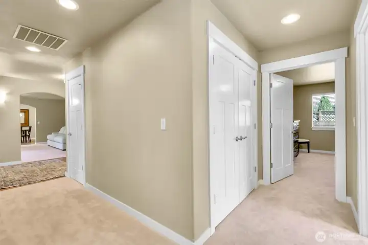Hallway that leads to the primary bedroom. Hallway that leads to the primary bedroom.