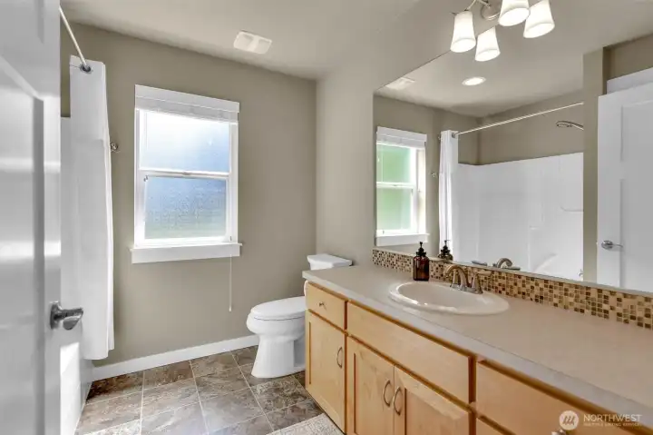 Full bath with a tub/shower combo. Full bath with a tub/shower combo.