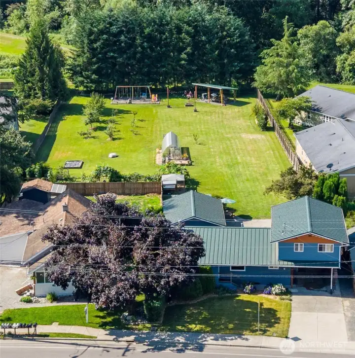 Fully fenced with established gardens on .88 acres Fully fenced with established gardens on .88 acres
