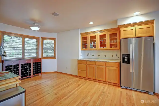 The kitchen is enormous~ check out the built-ins + space for casual dining/bistro set!