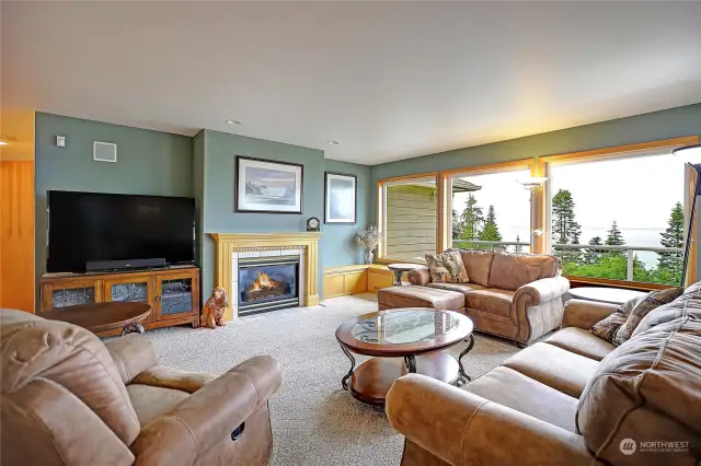 The spacious, view family/living room with propane fireplace is so inviting!