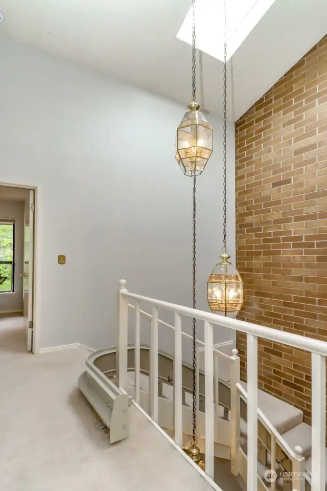 Notice the skylight and the drop lighting that accentuates the 3 story staircase in this townhouse floorplan.