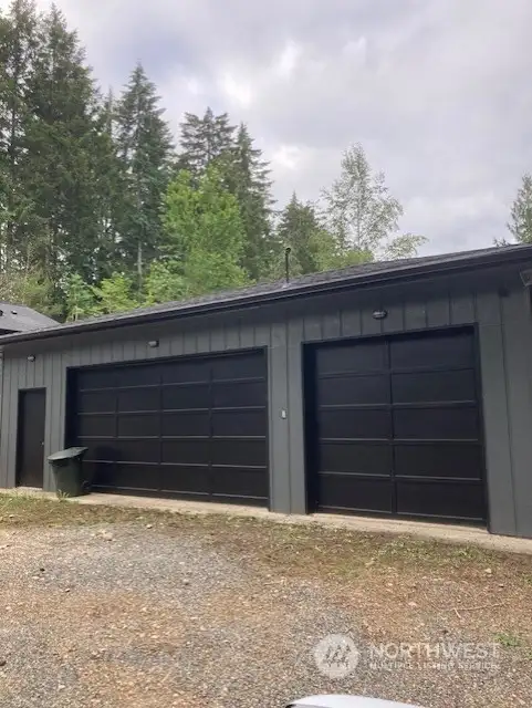 3 car detached garage with shop storage area.