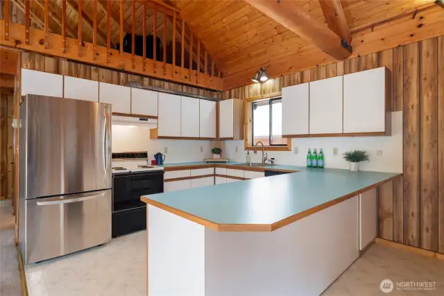 Kitchen with bar seating.