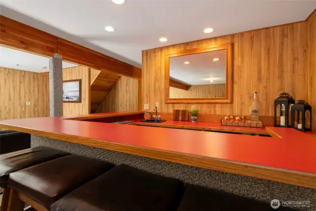 Large wet bar in the rec room is perfect for entertaining
