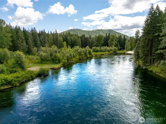 Private access to the Wenatchee River is just 1 block away from the home. Beach is shown to the left.