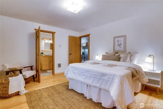 Spacious lower-level bedroom with en suite bath—perfect for guests, multi-gen living, or a peaceful private retreat.