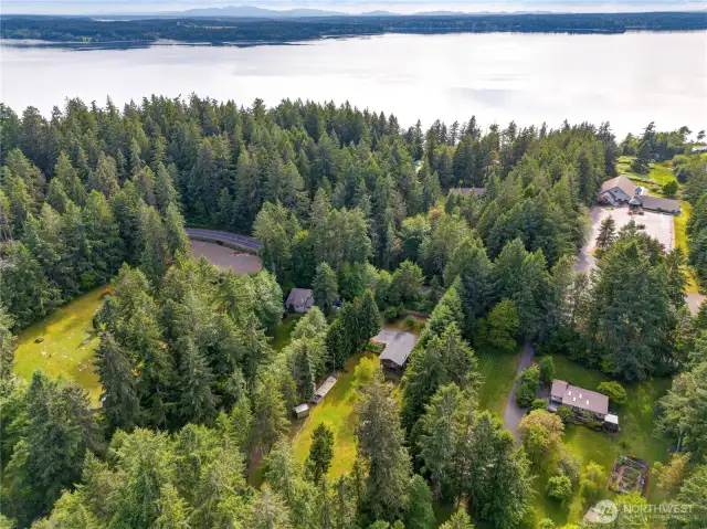 Located just across the Fox Island Bridge, this lush, secluded property combines convenience with serene PNW beauty—minutes from the water, a world away from the rush.