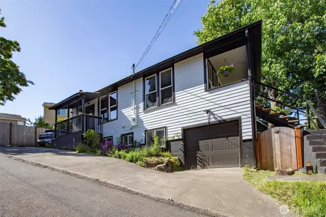 Located on a private drive, there is parking for 4, which includes an attached garage, a parking pad and two parallel spots.