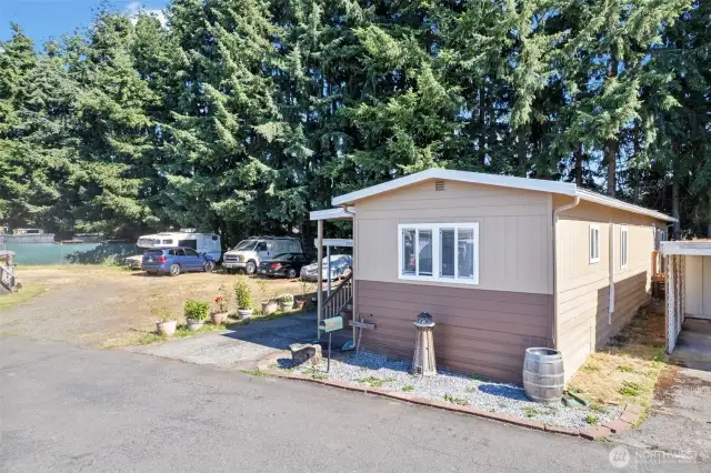 Sits like a corner lot. New exterior paint and a 1 car carport & storage with covered patio