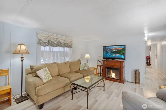 Living room has updated flooring and paint