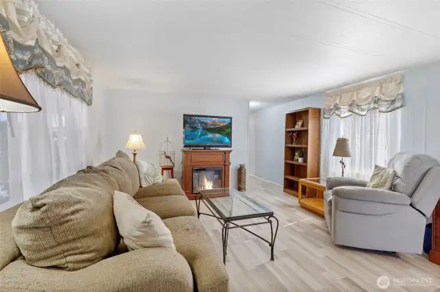 Hall way leads down to laundry, 2 bedrooms, full bath and another exterior door