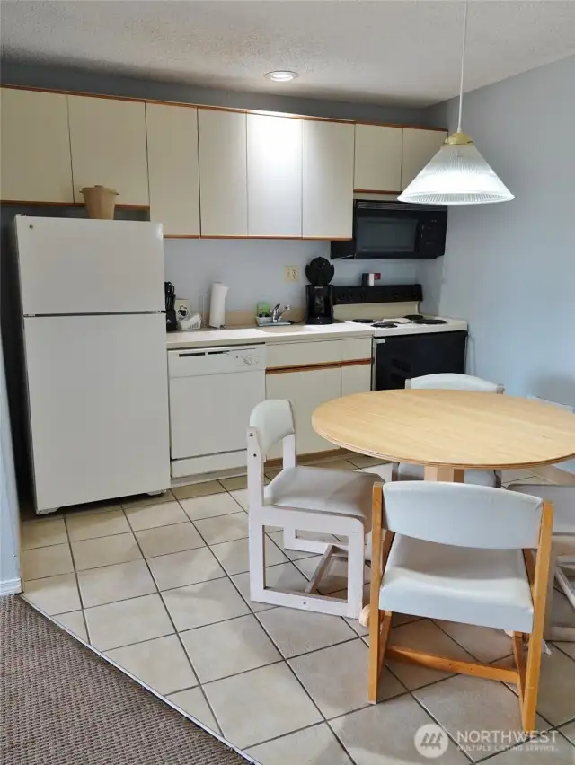Kitchen/Dining Area w/ tile floors.