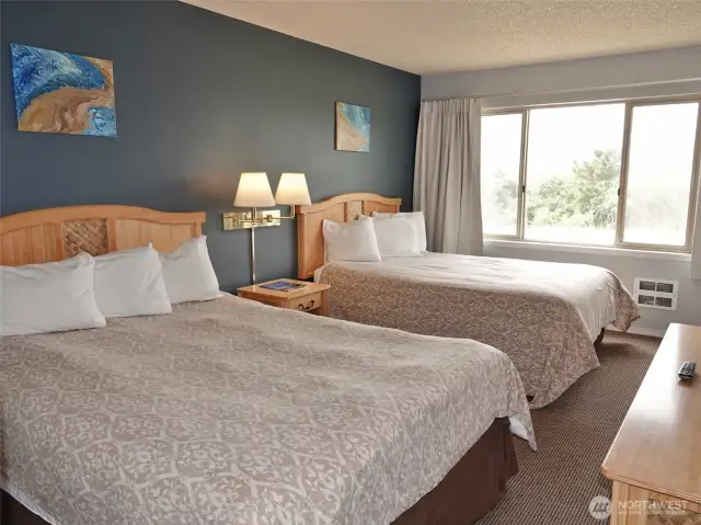 Spacious Bedroom w/ 2 Queen-sized beds.