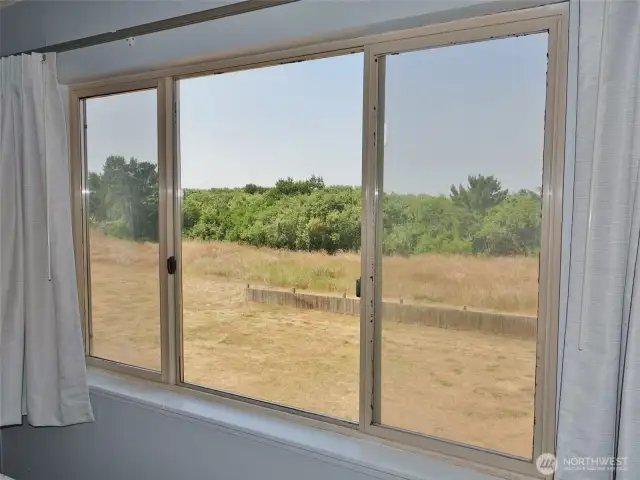 View from the Bedroom ~ looking West towards the backyard and Dunes Area behind the Property.