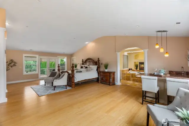 Enormous primary bedroom w/FP, sitting area, covered balcony