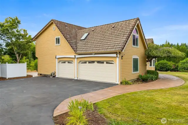 3 car attached garage w/ample parking. 4th bay is at rear of home w/seperate driveway