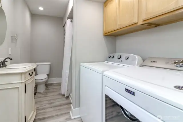Laundry room downstairs with 3/4 bath