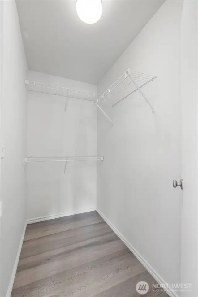 Walk in closet in primary bedroom