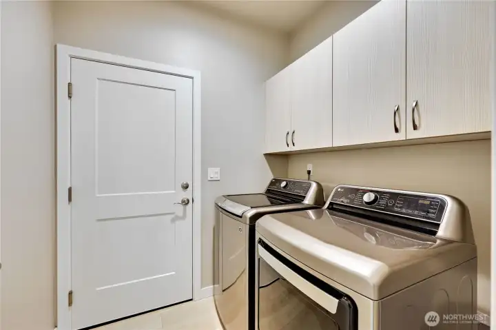 Laundry room with upper cabinets for extra storage