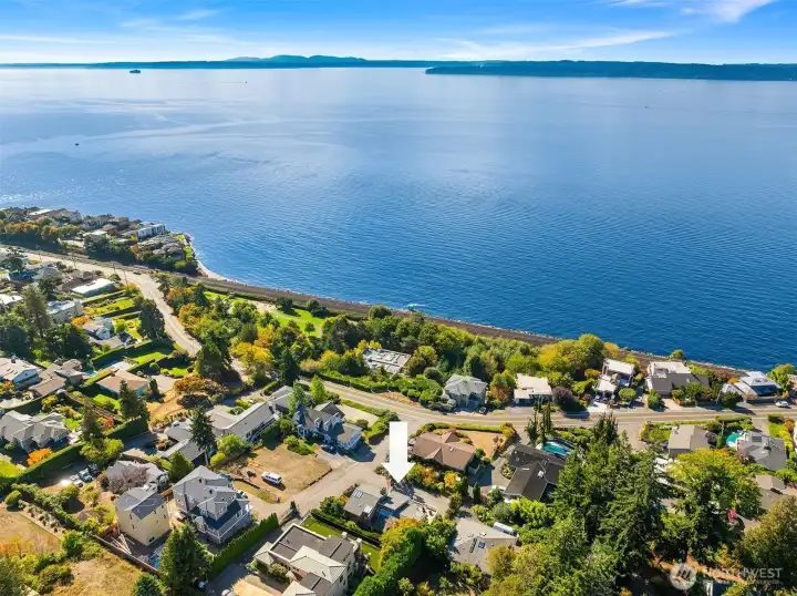 This stunning aerial shot highlights the home’s exceptional location just moments from the water, offering a rare blend of neighborhood charm and coastal scenery. Don't miss the short walk to Kayu Kayu Park.