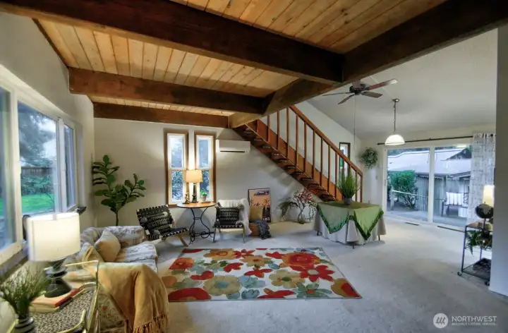 Light & bright contemporary living room warmed with wood tones.