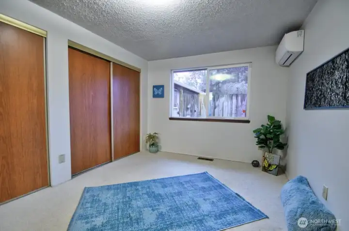 Primary bedroom, very roomy with its own ductless unit.