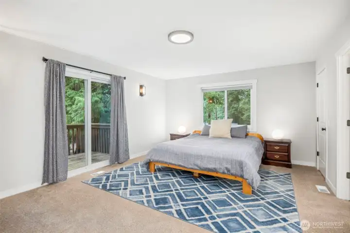 Primary bedroom with private balcony