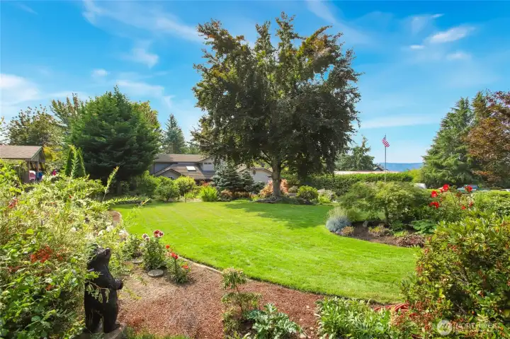 A hand-carved wooden bear keeps watch over the luxe property. Bear and flagpole stay.
