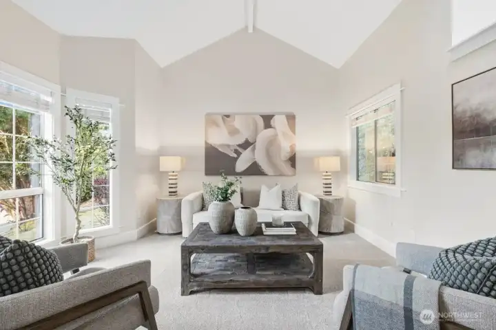Light and bright formal living room or flex space with vaulted ceilings