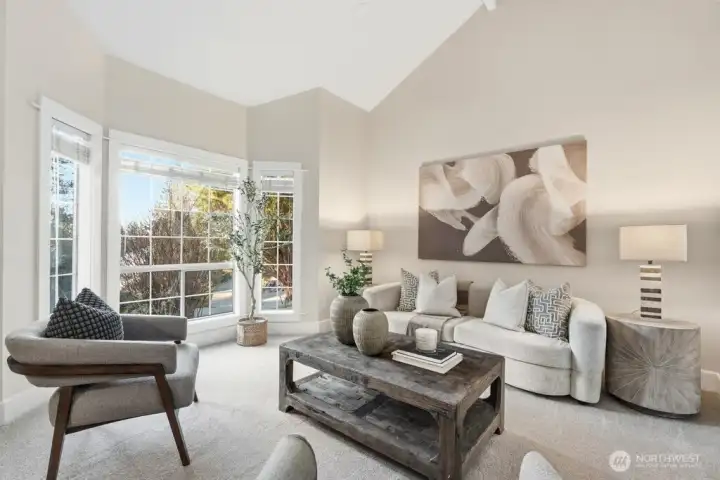Bay windows and fresh carpeting in main living space