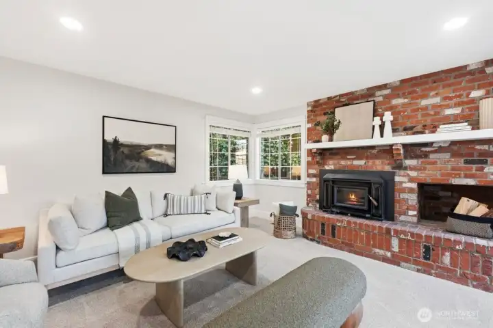 Spacious family room with cozy woodstove and beautiful brick hearth