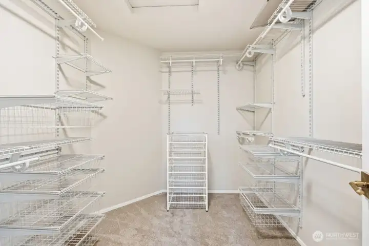 Large walk in closet space with organizers
