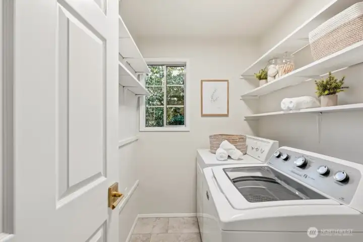 Large laundry center with storage and new Luxury Plank Flooring