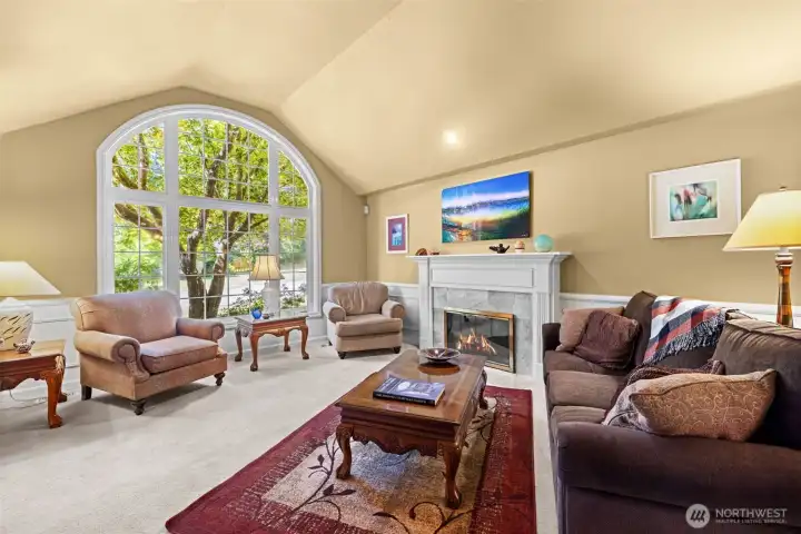Living room with large light-filled window.