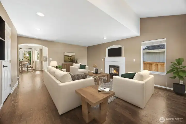 1 of 3 cozy fireplaces, welcomes you into the spacious family room.(virtually staged)