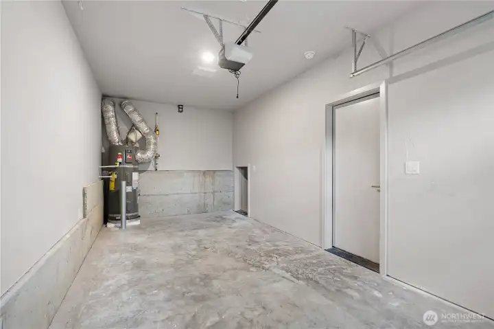 EV equipped private garage, accessed off of the kitchen. Don't miss the bonus storage closet in the garage!