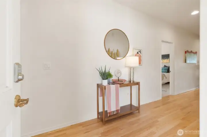 Open entryway with hardwood floors.