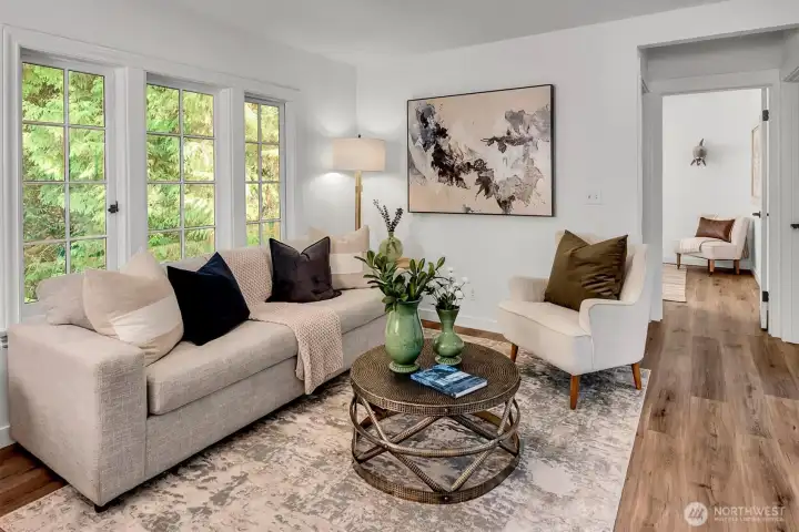 Cozy living room overlooks the evergreens and Thornton Creek.