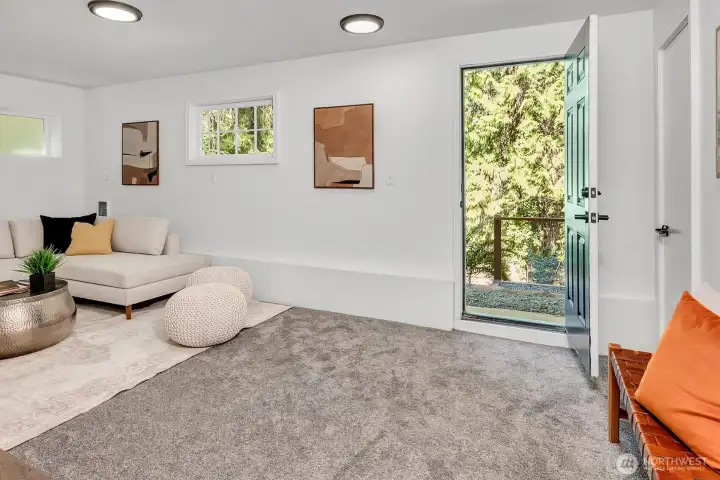 Recreation room door leads to the backyard oasis.