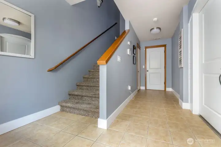 Entry, hallway to garage. Ground floor bedroom on the right.