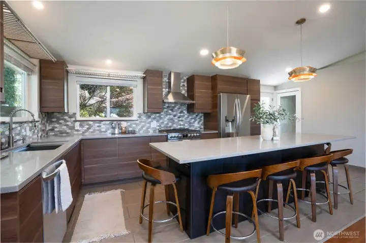 Island Seating for 6, Double Door Fridge & Lower Drawer Freezer...Doors to Back Patio & Fully Finished Lower Living Area...